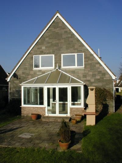The back of the house just after we moved in - complete with grotty conservatory