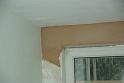 The builders are doing the plastering above the windows now