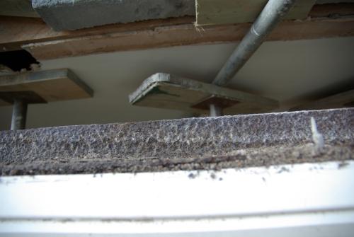 Looking through the gap where the lintel was into the living room at some of the props