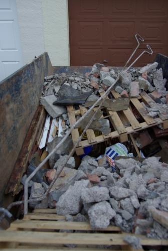 The remains of the big lintel in the skip