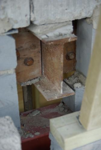 The only prop left in the living room supports this beam, which supports upstairs