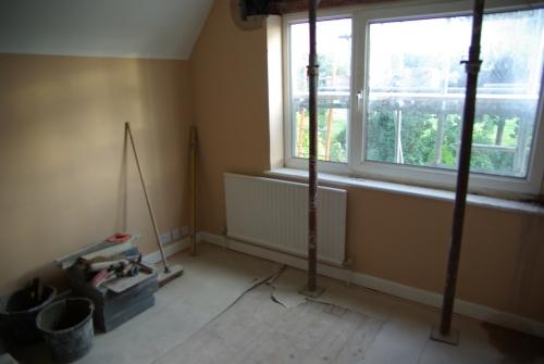 The left-hand bedroom is much less tidy