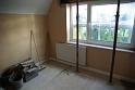 The left-hand bedroom is much less tidy